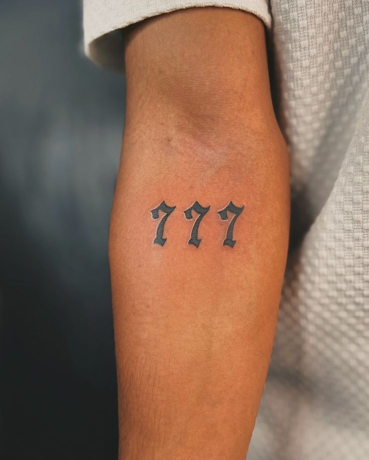 777 tattoo on neck