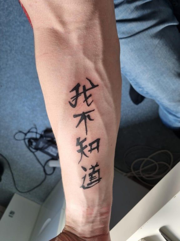 kaizen tattoo on forearm