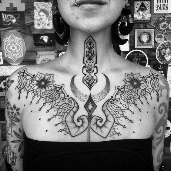 lotus flower tattoo between breast