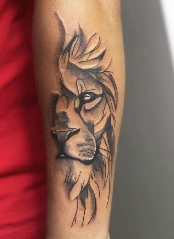 minimalist lioness tattoo