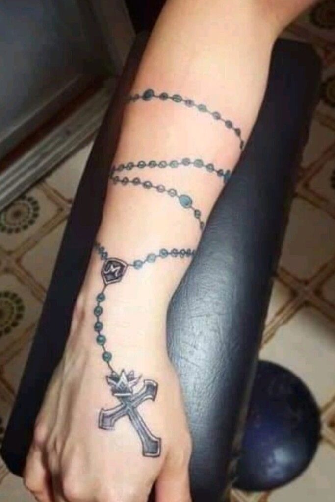 praying hands with rosary tattoo