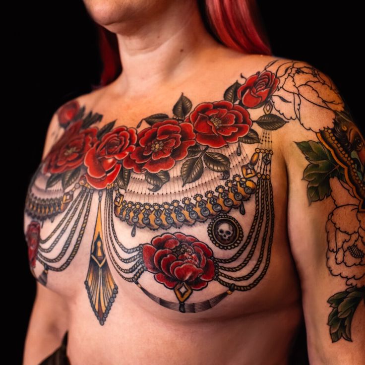 rose tattoo between breast