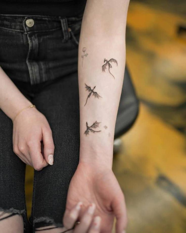 small dragon tattoos on arm