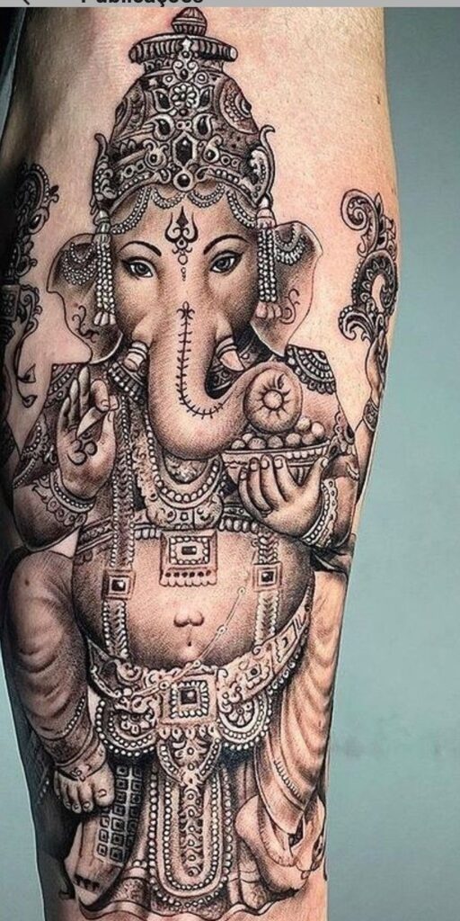 small ganesha tattoo on wrist

