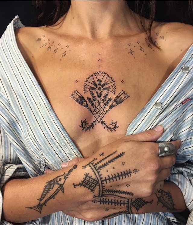 small tattoo between breast