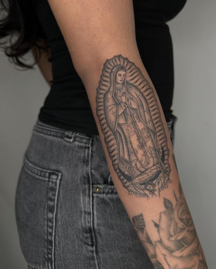 small virgin mary tattoo