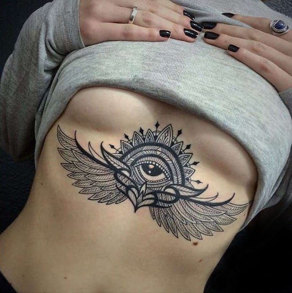 snake tattoo between breast meaning