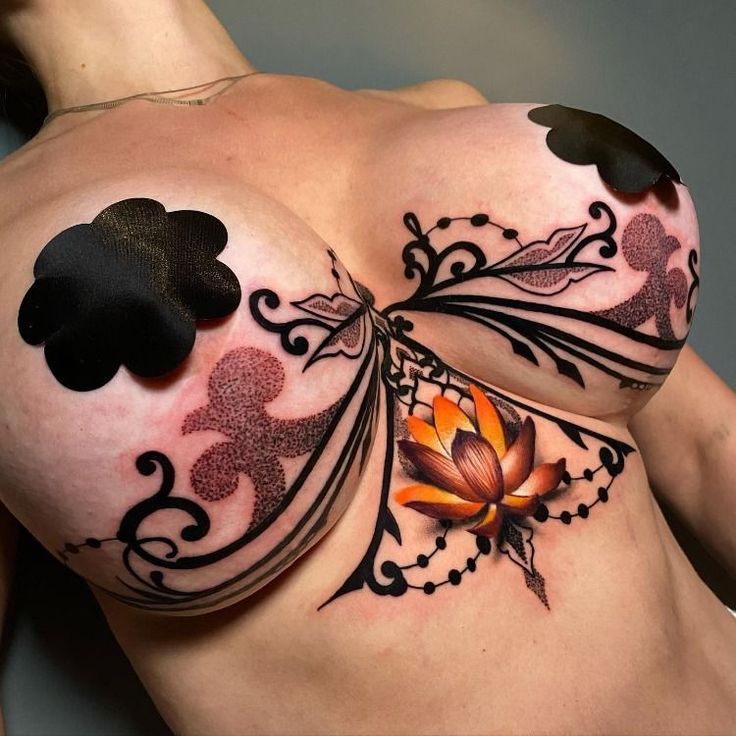 sternum under boob tattoo idea