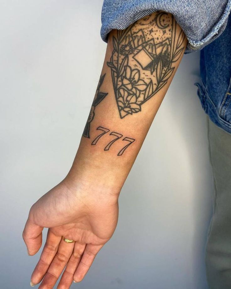 vertical 777 tattoo