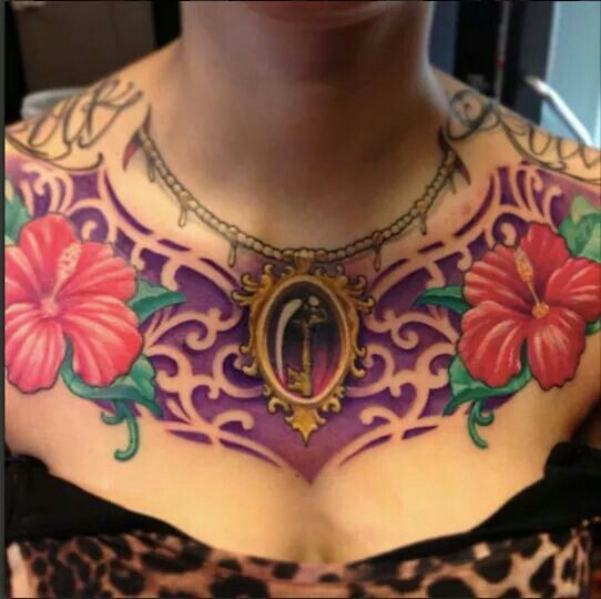 what does tattoo between breast mean